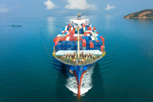 aerial-in-front-of-cargo-ship-carrying-container-resized