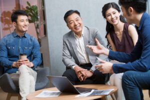 business-people-talking-in-meeting-with-a-laptop-2023-11-27-05-12-17-utc