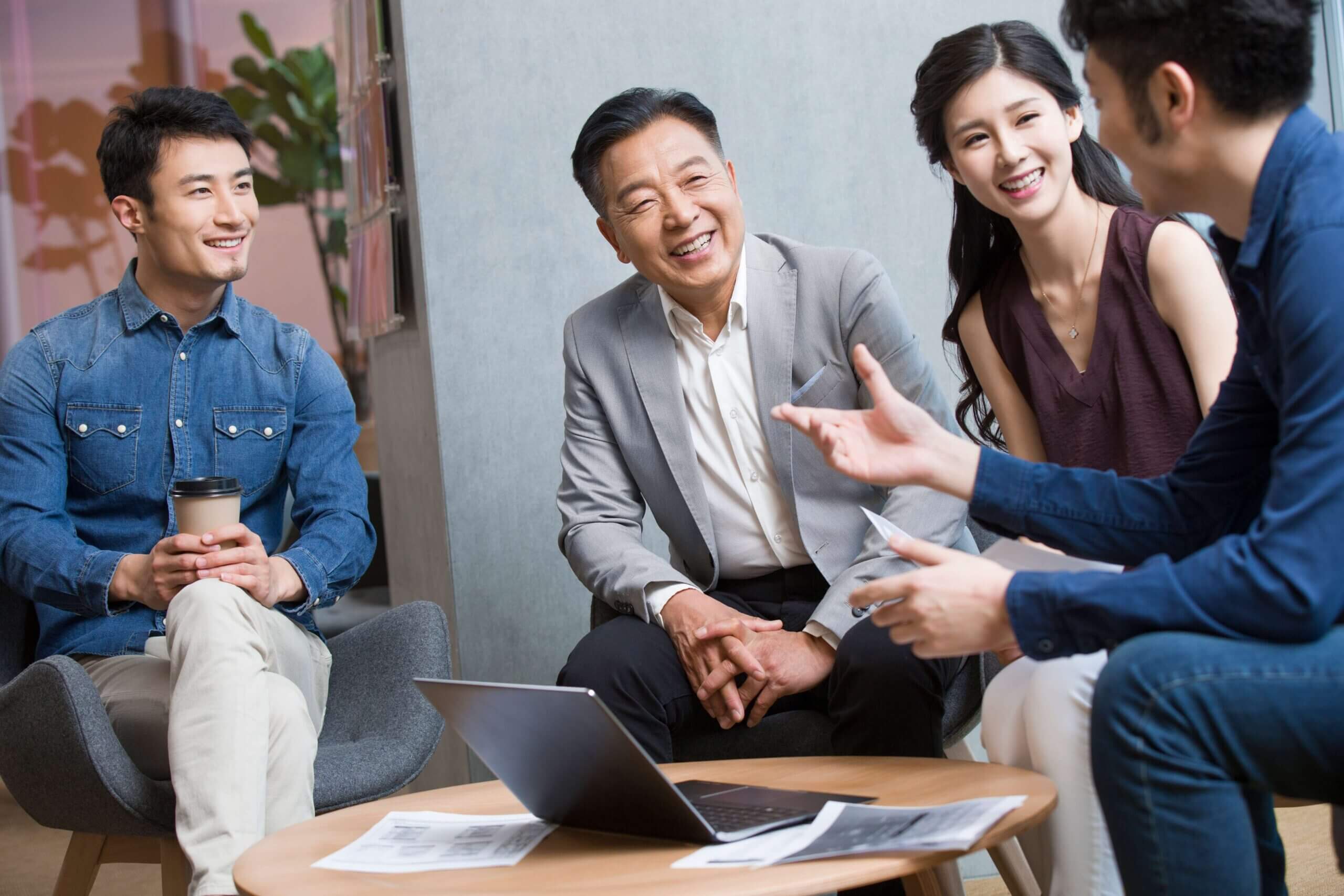 business-people-talking-in-meeting-with-a-laptop-2023-11-27-05-12-17-utc